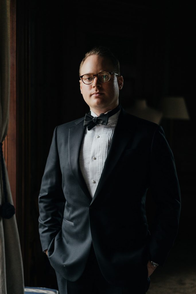 A groom posing for a portrait picture