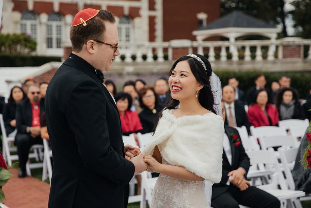 A bride looking at her groom during the ceremony