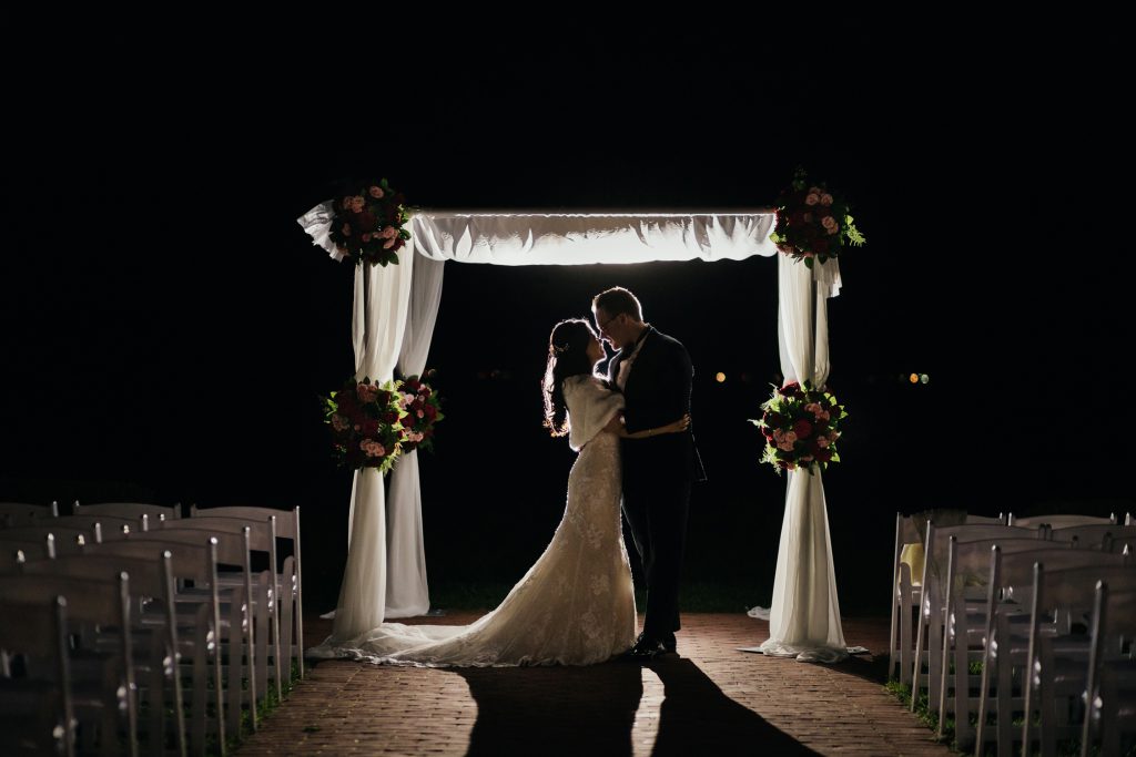 A newly wedded couple's kiss at the end of the night
