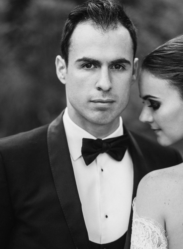 A newly wedded couple posing for a portrait in Central Park