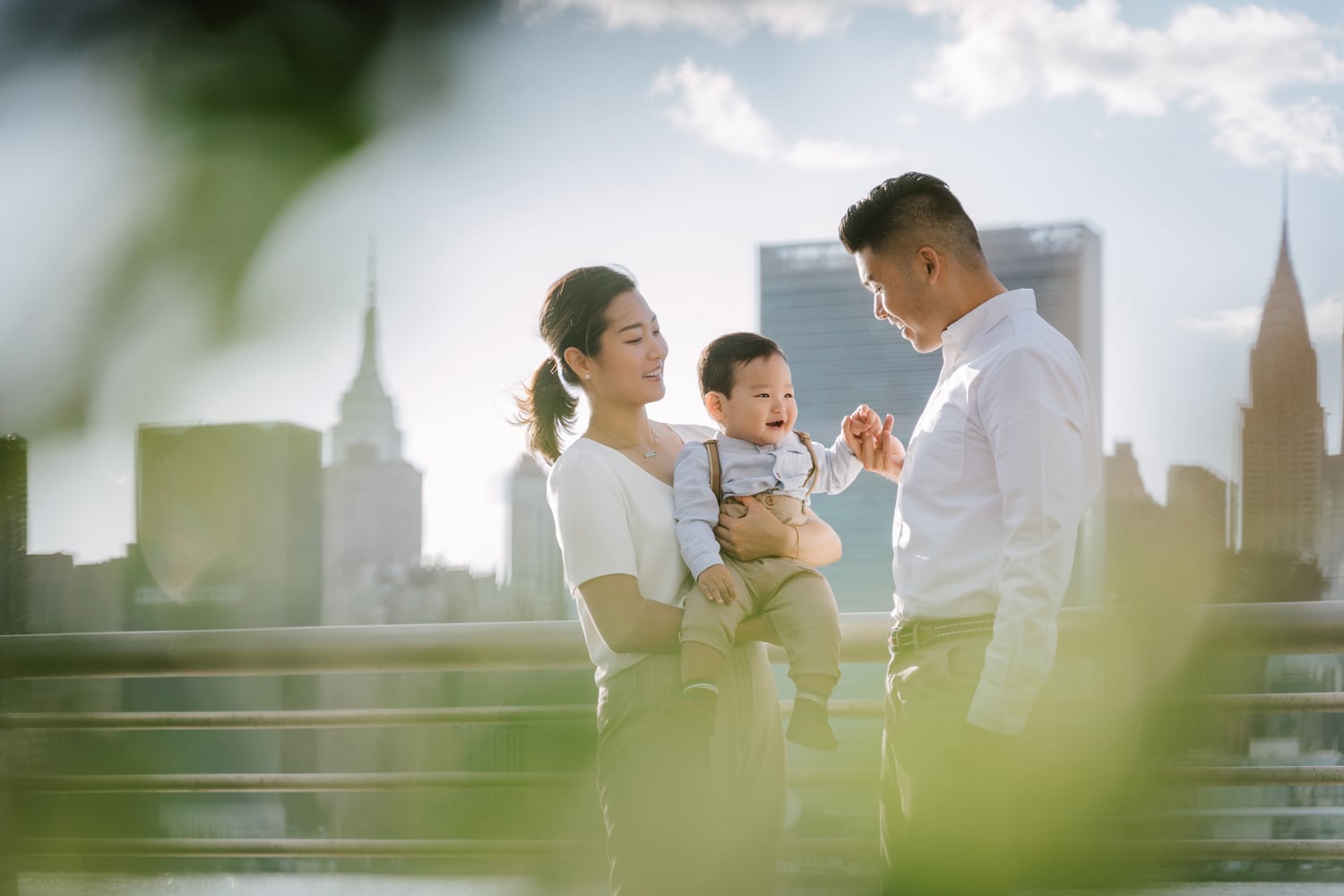 Family photosession at Gantry Plaza State Park with the Empire State Building in the background