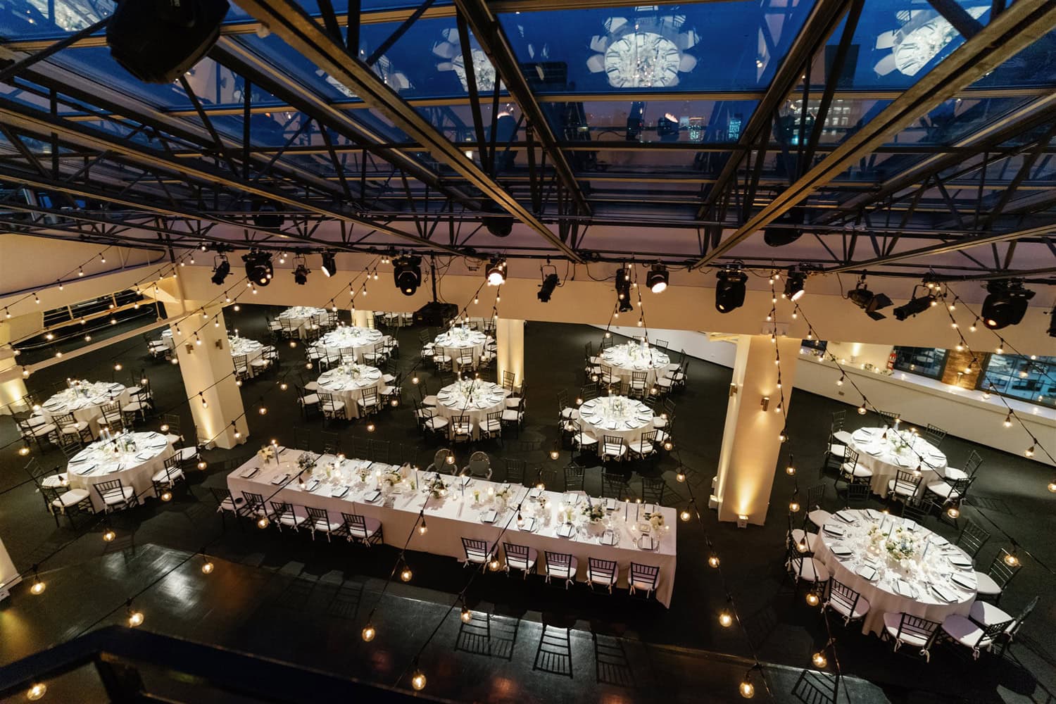 A wedding dinner reception setting at Tribeca Rooftop