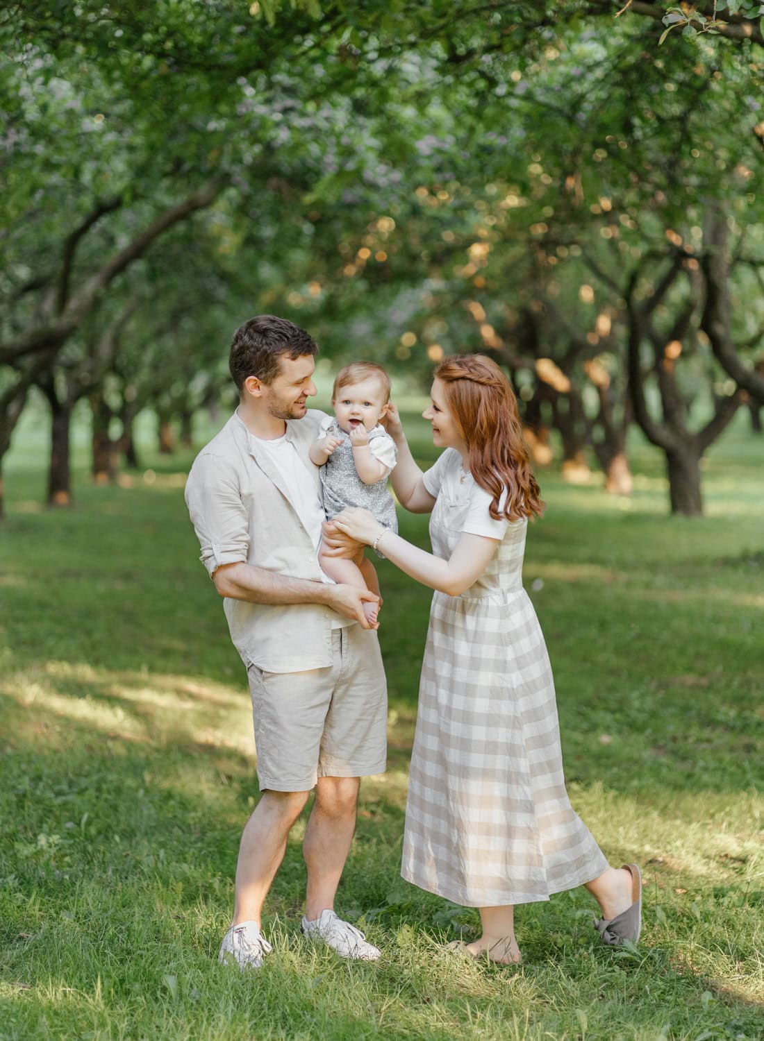 A family enjoying a beautiful day at a park in Yonkers, captured in a natural and relaxed setting.